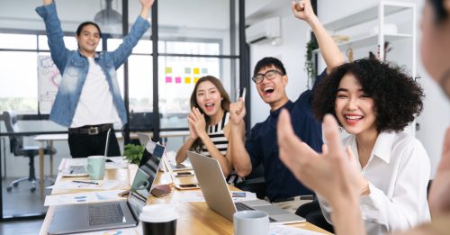 Asian team creative business people happy to be successful
